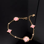 TimiSTAR AND SUN 4 MOTIF PINK MOP PINK GOLD BRACELET
