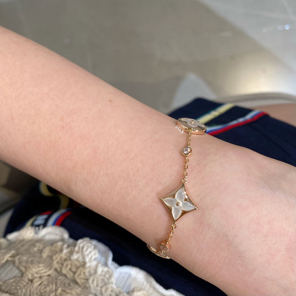 TimiSTAR AND SUN 4 MOTIF WHITE MOP PINK GOLD BRACELET