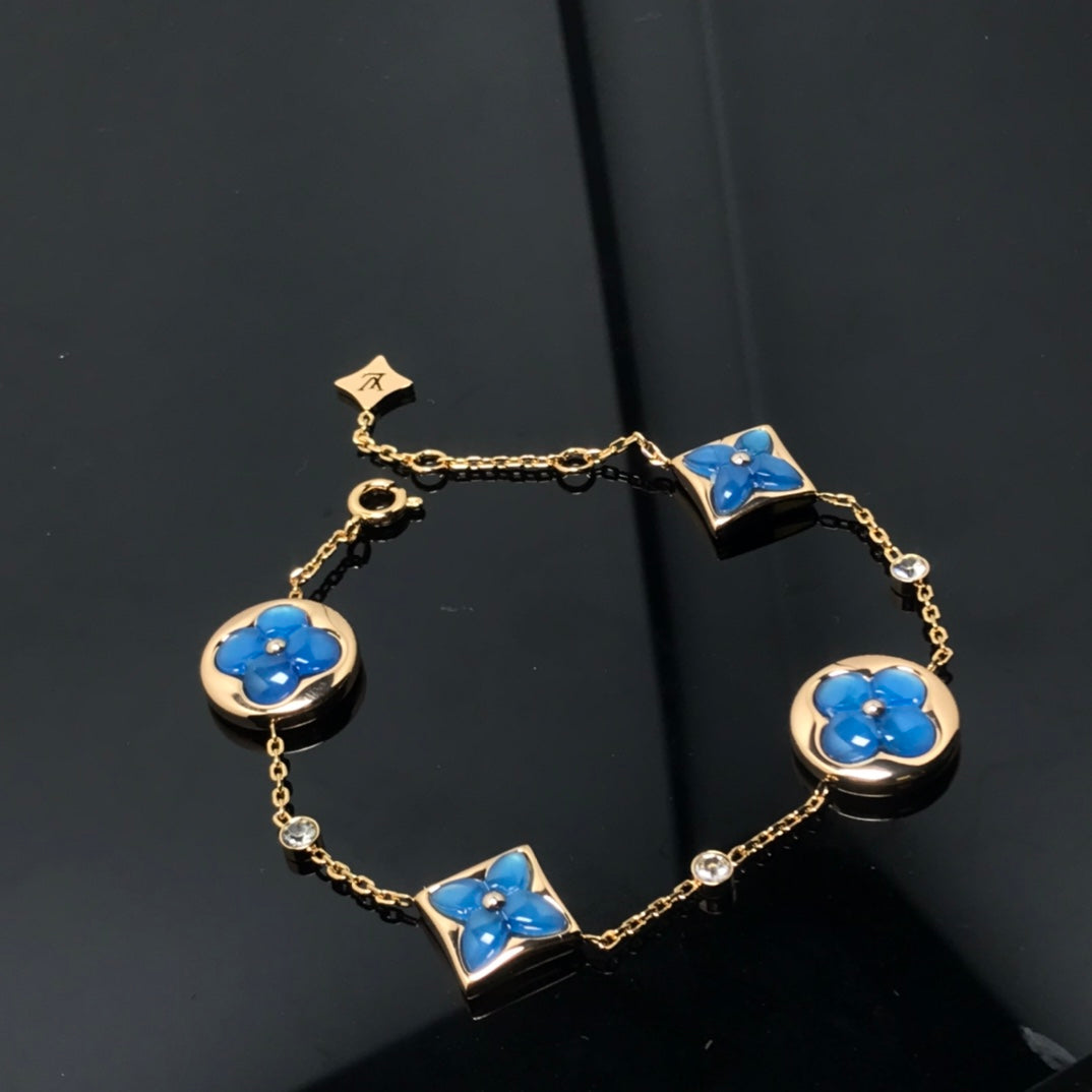 TimiSTAR AND SUN 4 MOTIF BLUE BRACELET